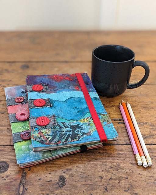 Mixed media journals created with fabric, paint and embroidery